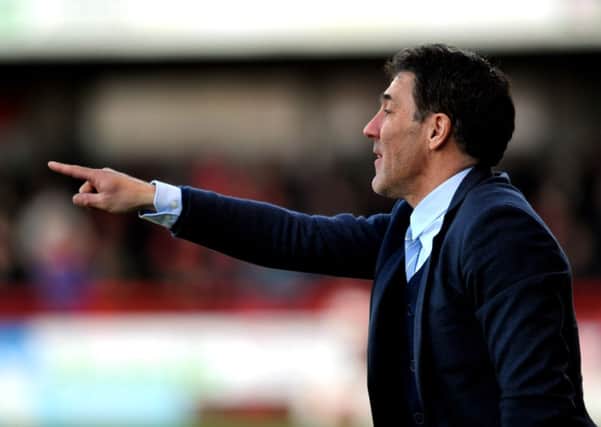 Dean Saunders the new Crawley Town manager watches his side against Colchester (Pic by Jon Rigby) PPP-141228-191450004