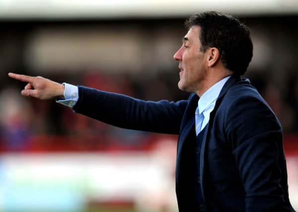 Dean Saunders the new Crawley Town manager watches his side against Colchester (Pic by Jon Rigby) PPP-141228-191450004