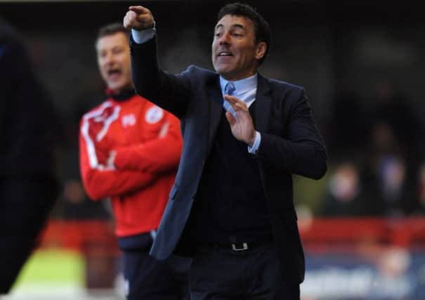 Dean Saunders the new Crawley Town manager watches his side against Colchester (Pic by Jon Rigby) PPP-141228-191331004