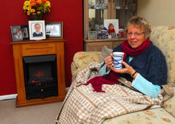 b12-034 Mollie Gauge of Sandy poses for Keep Warm feature to highlight the importance of keeping warm for the elderly in winter. ENGPNL00120121101190550