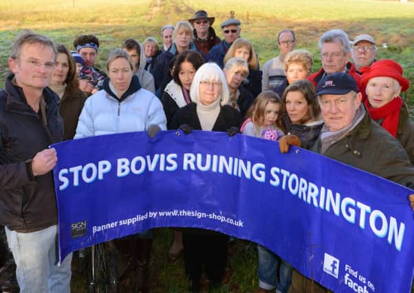 WSCT 161241  Protesters from the Stop Bovis Ruining Storrington Action Group at the western edge of Storrington. Photo by Derek Martin SUS-141216-165301001