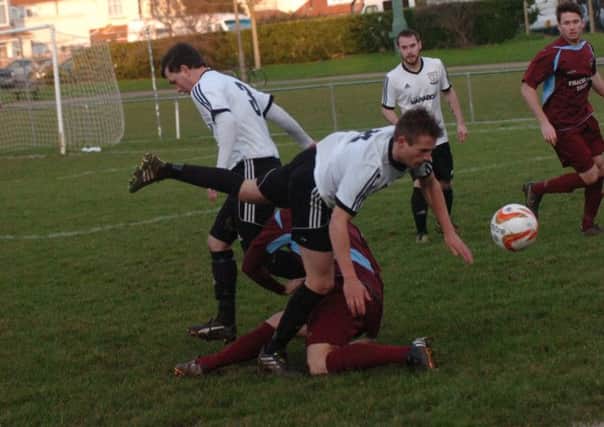 Action from Bexhill United's 1-0 victory at home to Little Common on December 27. Picture by Simon Newstead