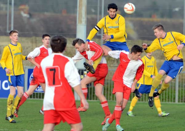 Selsey, in red and white, in action at Lancing   Picture by Derek Martin
