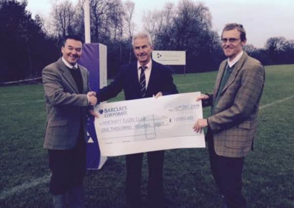 Henry Adams cheque handover to Horsham Rugby Club SUS-150113-102046001