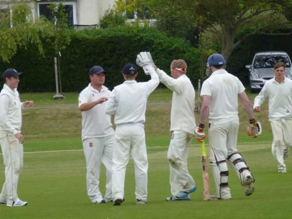 Bexhill celebrate a wicket during their Gray-Nicolls Sussex T20 Cup victory over Brighton & Hove last season. The teams will meet at The Polegrove on the opening day of the 2015 Sussex Premier League campaign
