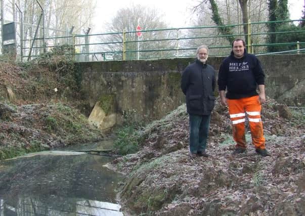 Project engineering Tony Ford (left) and site manager Dave Evans in front of the concrete causeway which blocks the Wey & Arun Canal at Alfold.