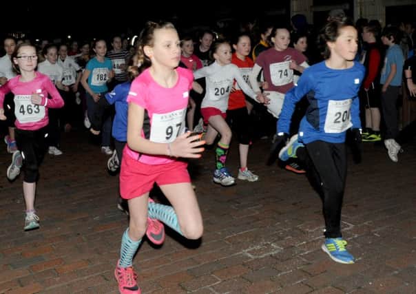 Action from one of the primary girls' races at the 2014 Corporate Challenge   Picture by Louise Adams C140262-7