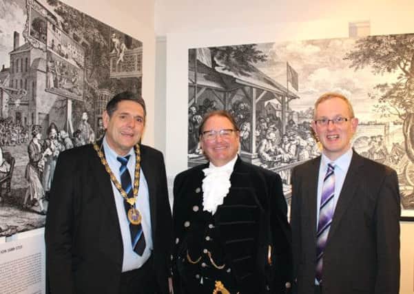 Above, from left, the Chairman of Horsham District Council, Cllr Brian O Connell with the Lord High Sherriff of West Sussex, Jonathan Lucas and Exhibition Curator, Jeremy Knight.