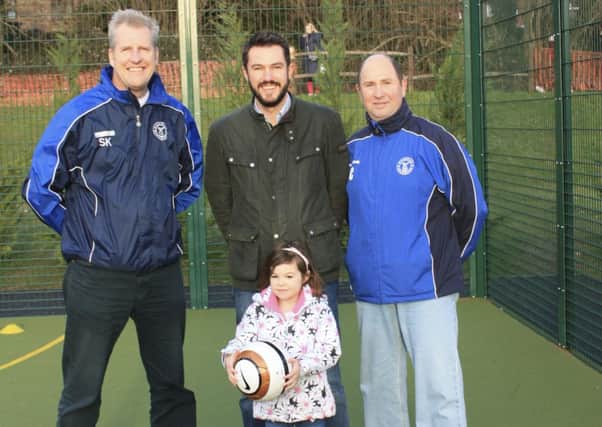 Simon King, Club Secretary, Horsham Sparrows,  Rob Elder, Director, Keysource, with his daughter, and Chris Cooper, Cub Chairman SUS-150121-114842001