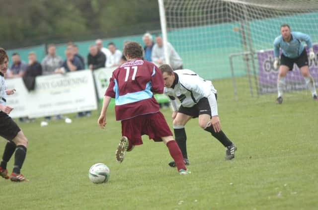 Little Common attacking player Adam Smith runs at the Bexhill United defence on Easter Monday last April