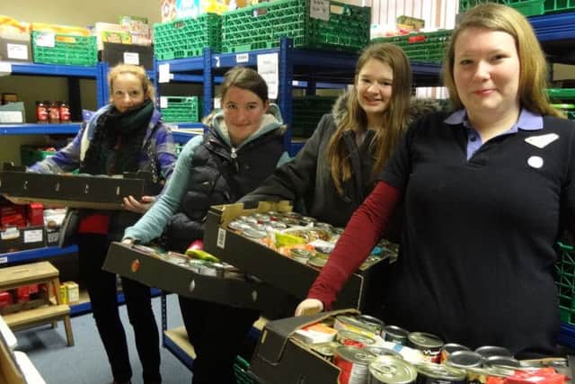Rangers carrying in the donations of food SUS-150123-101042001