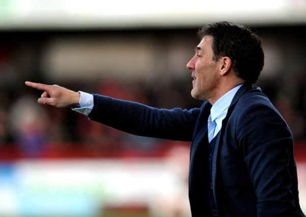 Dean Saunders the new Crawley Town manager watches his side against Colchester (Pic by Jon Rigby) PPP-141228-185043004