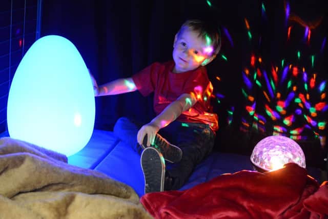 One of the youngsters enjoys his time in the new sensory room D15041134a