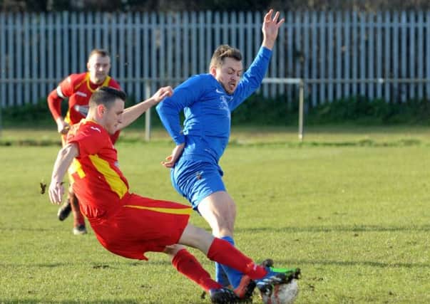 Mark Thompson is tenacious in the tackle for Selsey   Picture by Louise Adams 15lajan24d-5