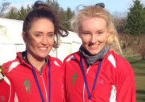 Grace Baker (left) and Amy Griffiths led Aldershot, Farnham & District AC to the team title