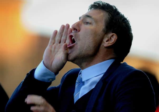 Dean Saunders the new Crawley Town manager watches his side against Colchester (Pic by Jon Rigby) PPP-141228-191319004