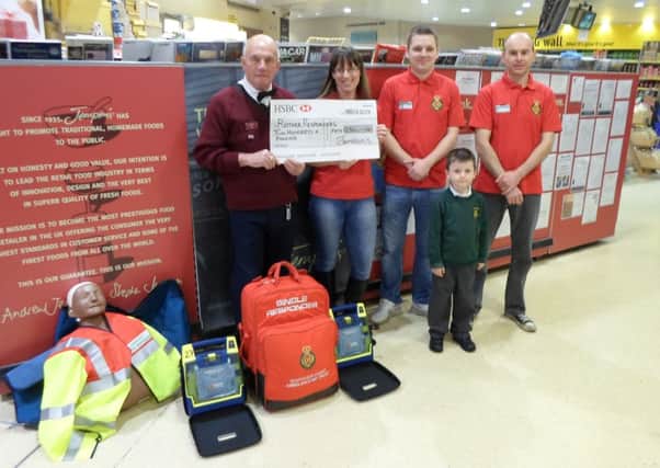 Photographed with Jempsons Peasmarsh store Greeter Pat Pepper are Rother Responders Michelle Kirkham, Jon Padovani, Carl Fraser & Tom. ENGSUS00120131203124058