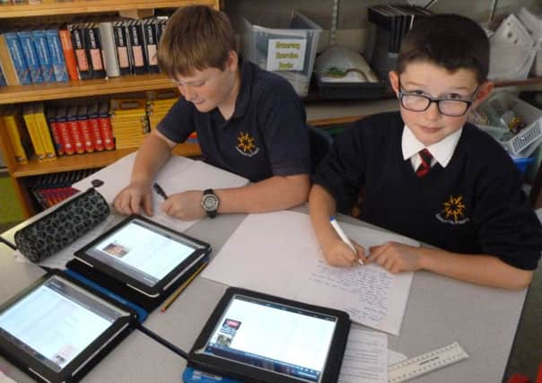 Learnpads in use at Salehurst Primary School SUS-150130-093431001