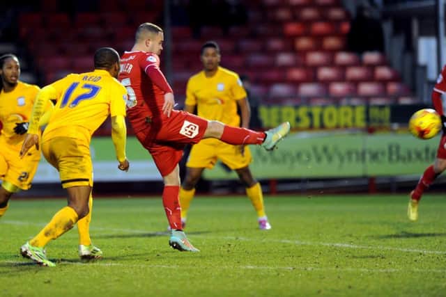 Lee Fowler scores the all important winner for Crawley Town against Preston North End (Pic by Jon & Joe Rigby) SUS-150131-183443002