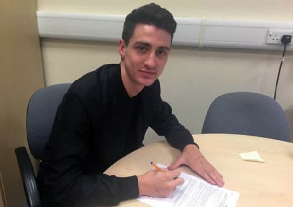 Greg Luer signs for Port Vale. Picture courtesy of Port Vale FC