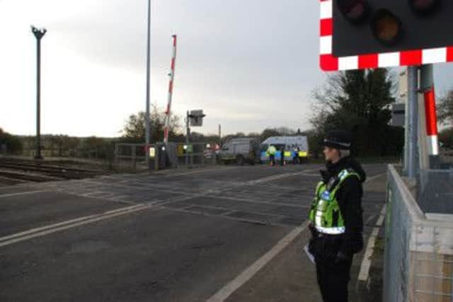 Officers at Ford crossing during a week of action to raise awareness of misusing level crossings SUS-150302-175531001