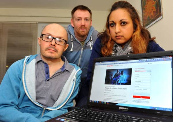 Simon Gray with his friend Sharmila Lyons who has set up a petition to keep him in Burgess Hill, Micky Lyons (centre). Pic Steve Robards SUS-150402-092858001