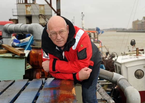 S06304H14-FishmongerShoreham

Fishmonger, Jim Partridge, Chairman at Monteum, is having a bad season as the storms cause a fish shortage. Pictured at Fisherman's Wharf, Shoreham. ENGSUS00120141102181732