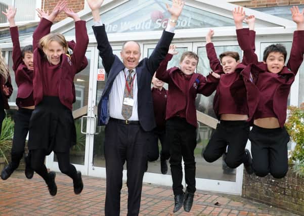 JPCT 030215 S15050704w Billingshurst.  The Weald school's £10m expansion project has been approved by West Sussex County Council planning committee. Peter Woodman and some Year 7 students -photo by Steve Cobb SUS-150302-160902001