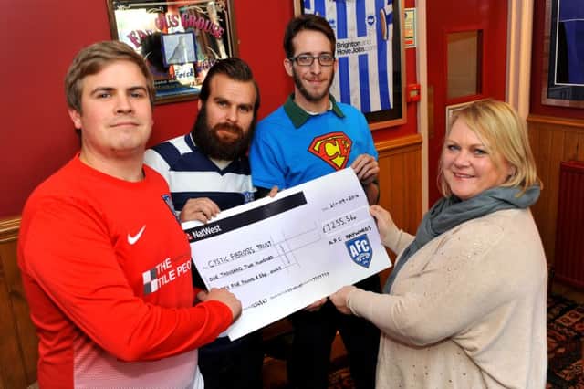 Jon Fabian, Terry Wallis and Martin Tallant of AFC Haywards present a cheque for £1255.56 to Sam Carter of the Cystic Fibrosis Trust. Pic Steve Robards SUS-150128-154018001