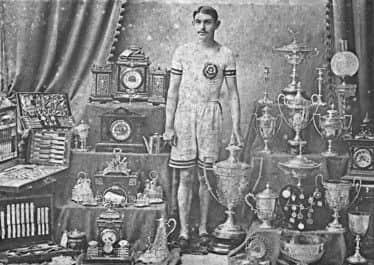 Alfred Shrubb with just a few of his trophies