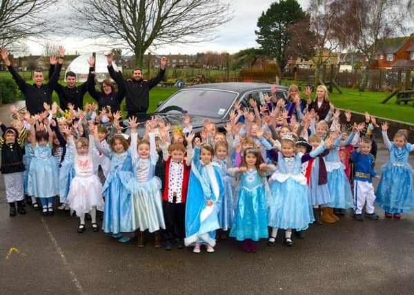 Children beside the £363,758 Rolls-Royce Phantom
