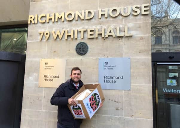Chichester Observer chief reporter Steve Pickthall delivers the A&E SOS petition to the Department of Health in Whitehall