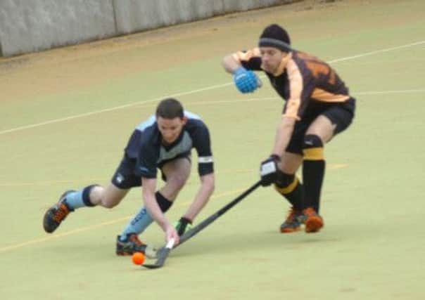 South Saxons Hockey Club captain Jamie Busbridge goes for goal during the 3-0 win over Penguin on Saturday. Picture by Simon Newstead (SUS-150802-111705002)