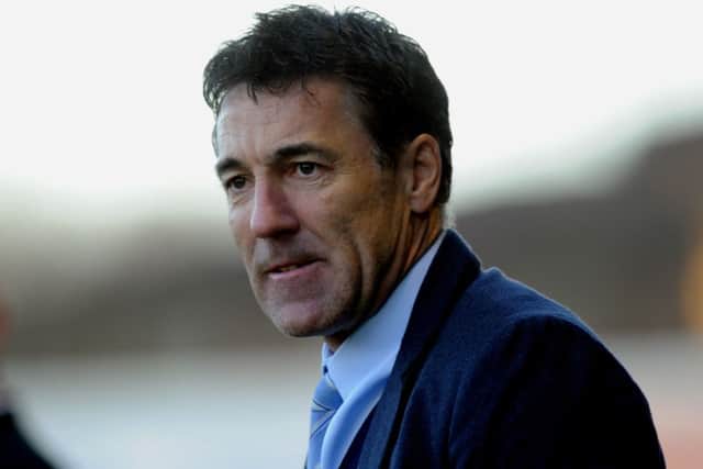 Dean Saunders the new Crawley Town manager watches his side against Colchester (Pic by Jon Rigby) PPP-141228-185117004