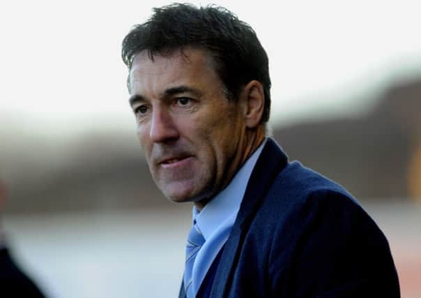 Dean Saunders the new Crawley Town manager watches his side against Colchester (Pic by Jon Rigby) PPP-141228-185117004