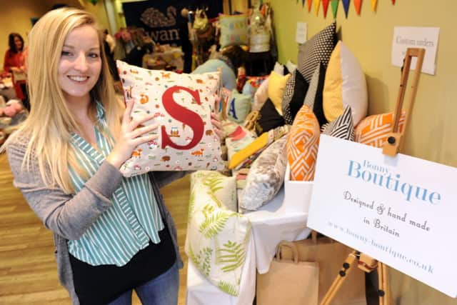 JPCT 070215 S15060287x Sara Chorlton on her cushion stall, Bonny Boutique,  at a pop-up craft shop in Swan Walk Shopping Centre as part of Age UK Bobble Day raising awareness of the Spread the Warmth campaign. Horsham. J -photo by Steve Cobb SUS-150702-112019001