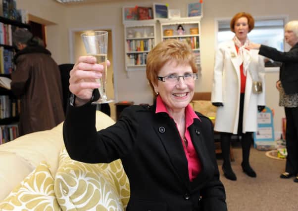 Cancer survivor Jan Sheward raises a glass in celebration