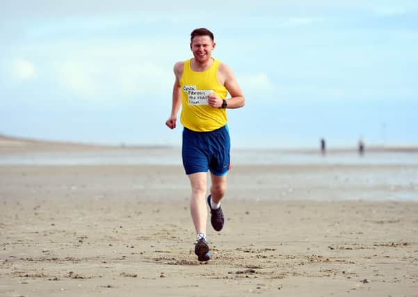 Ben Algar, pictured, has been training for his marathon by running along the coast