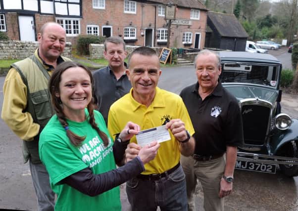 JPCT 110215 S15060870x  Nuthurst Black Horse Golf society presenting cheque to MacMillan cancer support. Jan Pieniazek, Steph Georgalakis, landlord Rob Cole, Steve Holloway out-going captain, and Mike Hoare -photo by Steve Cobb SUS-151102-123443001