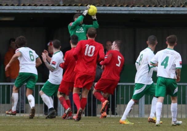 Chris Winterton claims a catch in Bognor's win over Harrow  Picture by Tim Hale