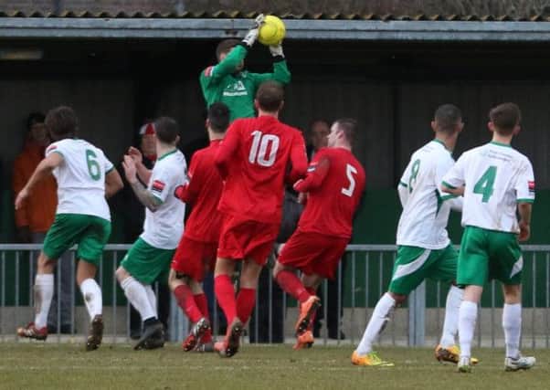 Chris Winterton claims a catch in Bognor's win over Harrow  Picture by Tim Hale