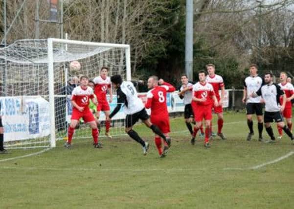 Goalmouth action as Pagham press Dorking   Picture by Roger Smith