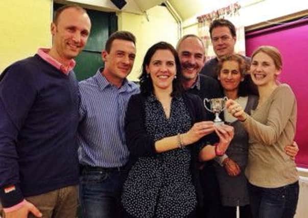 ?The happy winners of last year's ?quiz night at Bury Village Hall SUS-150216-123551001