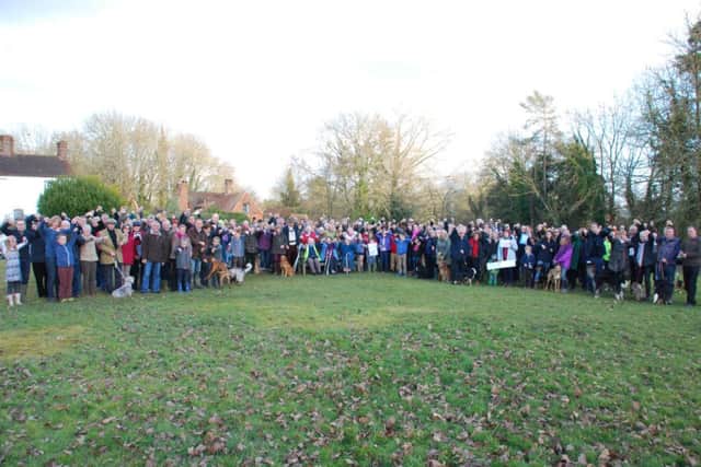 Protect Our Rural Environment (PORE) supporters meet on Plaistow Village Green to oppose the activities at Crouchlands Farm SUS-150216-142719001
