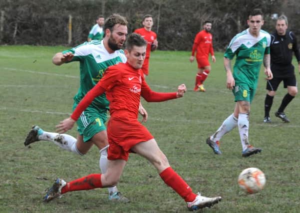 Alex Barnes stretches for the ball in Bosham's defeat to Sids   Picture by Kate Shemilt C150021-4