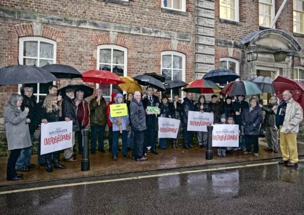 A group of petitioners gathered outside Park House in Horsham on a wet afternoon to witness the handover of their petition to the Chairman of Horsham District Council, Cllr OConnell.
all copyrights reserved © 2015 Art Hutchins ~ www.artseye.me SUS-150217-152844001