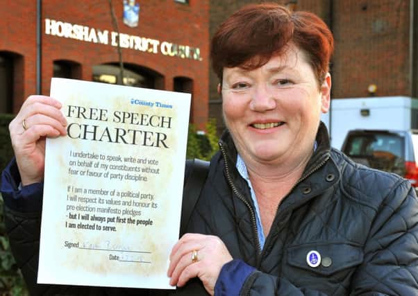 Karen Burgess outside the Horsham District Council offices with the Free Speech Charter. Pic Steve Robards SUS-150218-092552001