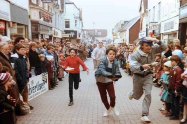 JPCT 170215 S15071630x Horsham Pancake Races, Carfax, Rotary Club. COPY PHOTO of races in West Street SUS-150217-151216001