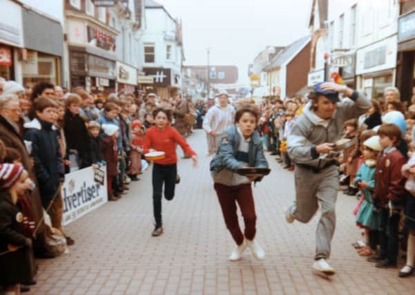 JPCT 170215 S15071630x Horsham Pancake Races, Carfax, Rotary Club. COPY PHOTO of races in West Street SUS-150217-151216001