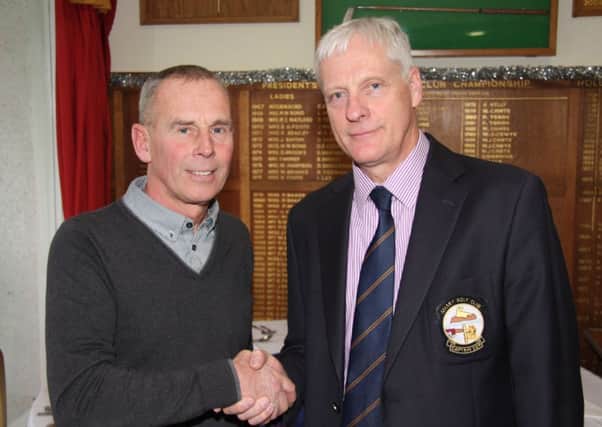 Brian Blackman is congratulated by Mervyn Smith for winning Selsey's order of merit